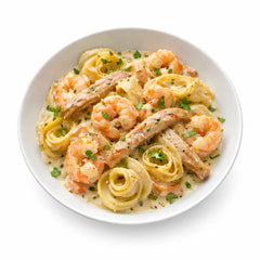 Tagliatelle Salmone mit Lachs, Zwiebeln und Tomaten-Sahnesauce